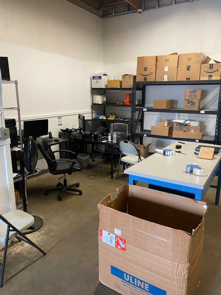 Packing station with shelving and supplies
