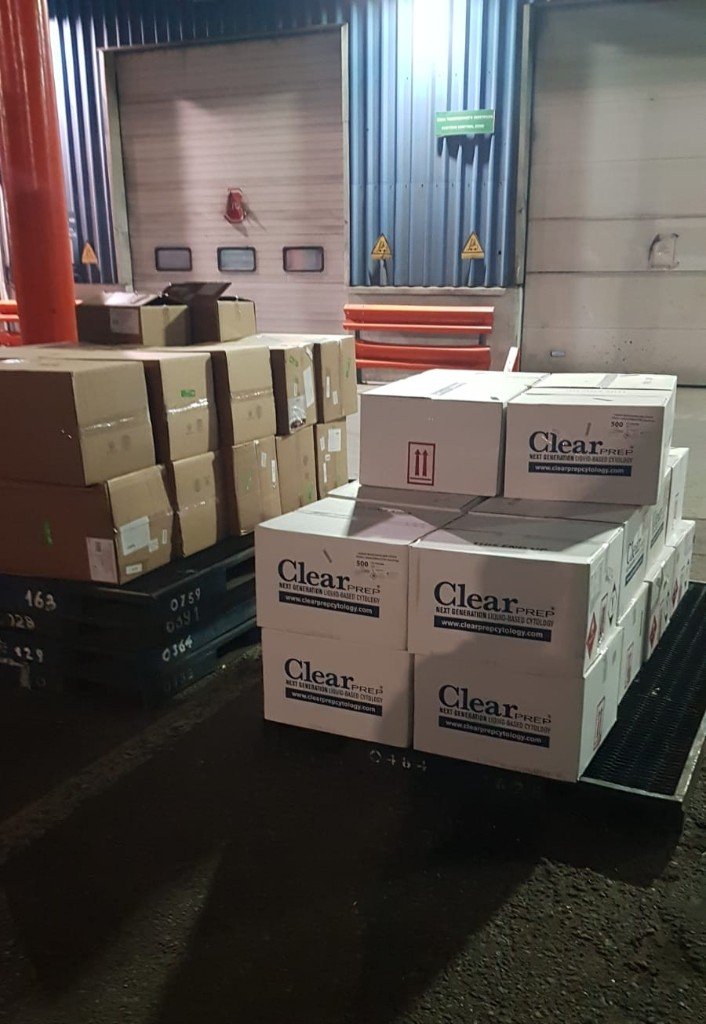 Pallets at a loading dock door at night
