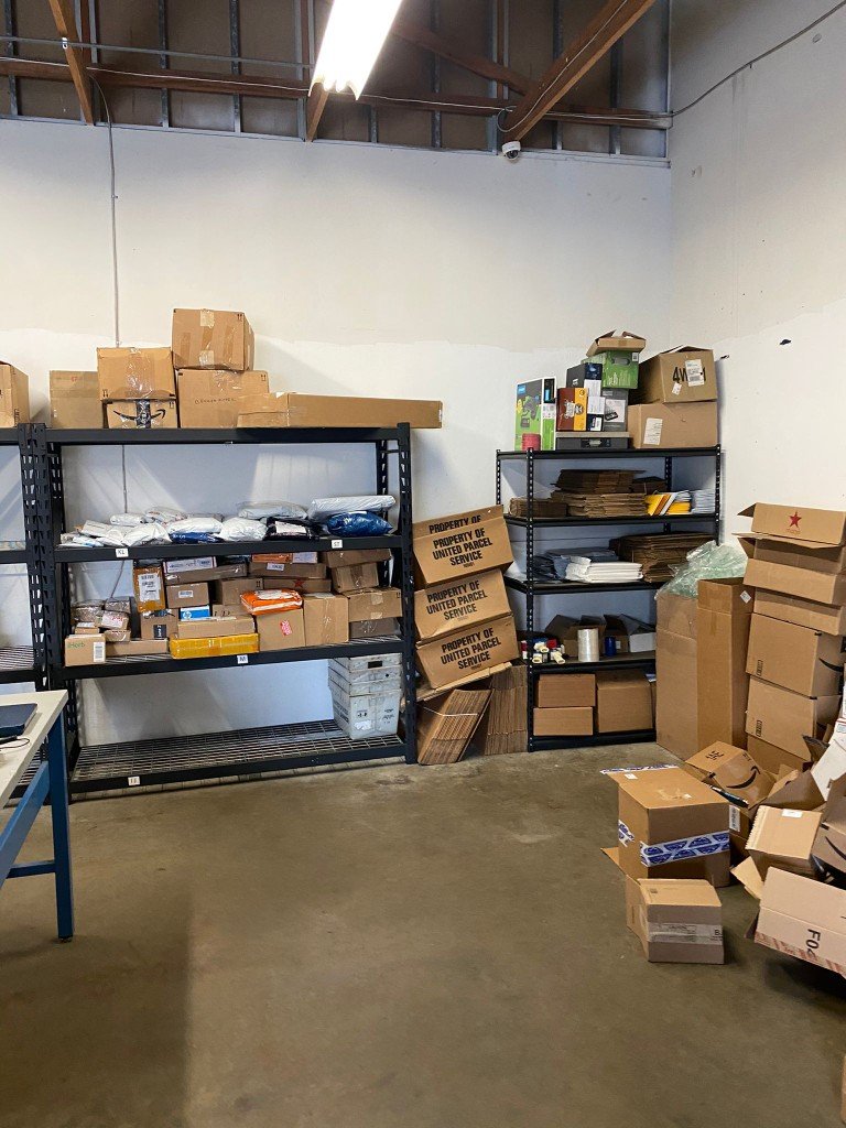 Stocked shelves with parcels and packaging materials
